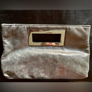 Micheal Kors Pewter colored clutch bag with silver accents